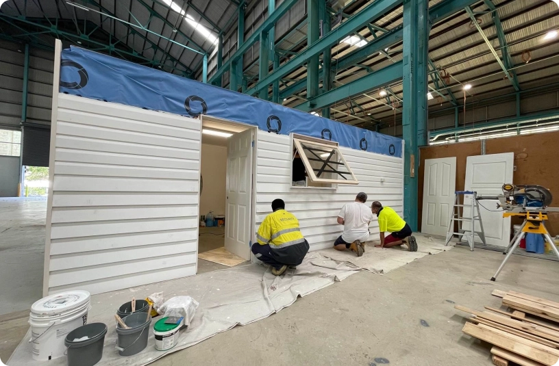 students painting in workshop