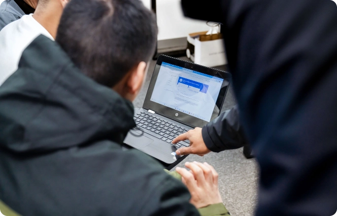 students working at laptops