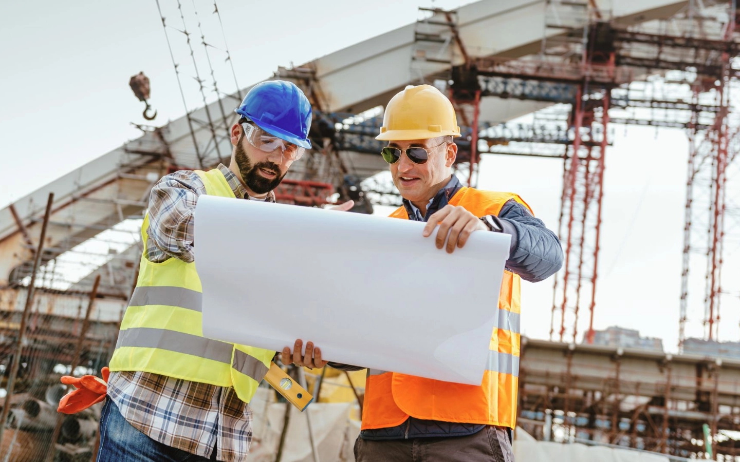 construction workers looking over plans