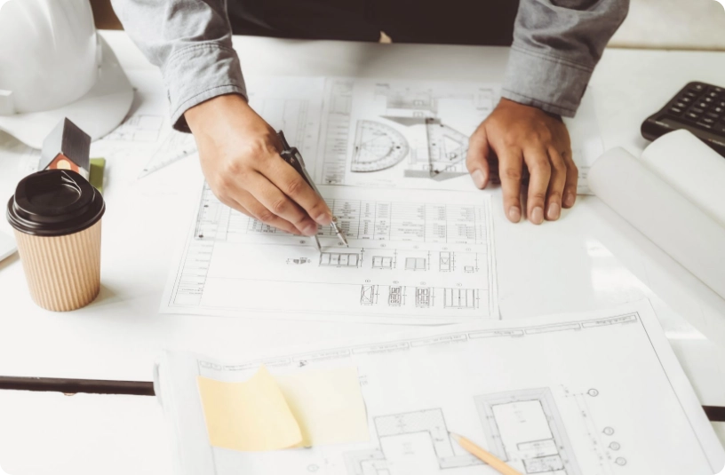 worker editing plans in meeting