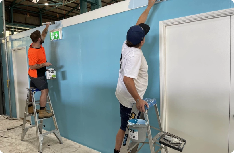 students painting in workshop