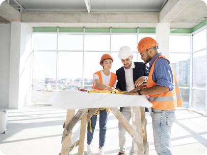 team discussing plans on site