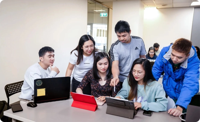 students working at laptops