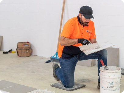 students tiling in workshop